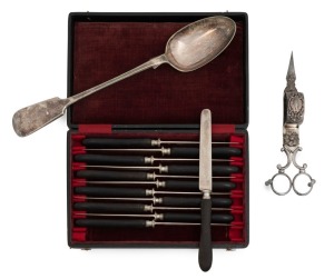 An early Sheffield Plate scissor wick-trimmer with Rococo decoration, circa 1825; a fiddle pattern silver plated stuffing spoon, circa 1860; also a cased set of 12 steel-bladed fruit knives with original horn handles, circa 1860s, (3 items), the spoon 30c