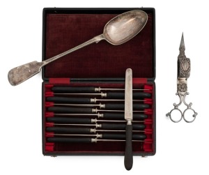 An early Sheffield Plate scissor wick-trimmer with Rococo decoration, circa 1825; a fiddle pattern silver plated stuffing spoon, circa 1860; also a cased set of 12 steel-bladed fruit knives with original horn handles, circa 1860s, (3 items), the spoon 30cm long.