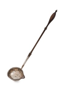 HESTER BATEMAN fine antique English sterling silver toddy ladle with deep bowl, beaded edge decoration and silver mounting shaft; fitted to the original delicately turned ebonized fruitwood handle. Maker's mark for Hester Bateman of London, circa 1782, 34cm long.