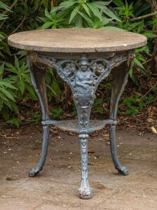 An antique English "Britannia" pub table, painted cast iron with composition stone top, 19th century, 76cm high, 71cm diameter