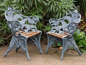 COALBROOKDALE "Fern" pattern pair of cast iron garden chairs, 19th century, 90cm high, 65cm across the arms