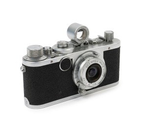 LEITZ: Leica Model Ic [#455931], 1949, "Shark skin" leatherette body casing, fitted with OEINO rangefinder and with Elmar f3.5 50mm Lens [#711854] and bakelite front lens cap.