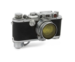 LEITZ: Leica Model IIIa Chrome D.R.P. 2nd Line [#332619], 1939, with Summitar f2 50mm lens [#489900], a Leitz yellow filter and a Leica metal cap. Camera base fitted with SCNOO Rapid Winder.