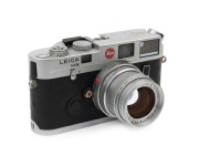 LEITZ: Leica Model M6 Year of the Rooster 1993 [#1929147],  #147 of 268 manufactured, fitted with silver finish Sumircron-M f2 50mm lens with matching serial number [#147/300]. The top of the camera body engraved with a golden rooster plus the phrase in C - 2