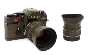 LEITZ Portugal: Leica R3 Electronic Safari [#1469842], 1978, fitted with Summilux-R f4 50mm lens [#2806895]. Together with a Leitz 12508 lens hood and an additional Elmarit-R f2.8 28mm lens [#2876165] with rear cap and hood. Original Leitz certificate for