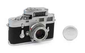 LEITZ: Leica Model M3 Double Stroke Advance [#801136], 1955, with Elmar f2.8 50mm lens [#1727295] and Leica meter MC [#46424]. Leica metal lens cap present. 