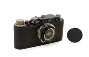 LEITZ: Leica Model II Black [#83824], 1932, with interchangeable Elmar f3.5 50mm [#126063] lens; "Zu" and "Auf" on base with Elmar slip-on filter and original lens cap. 