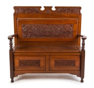 An antique Australian hall seat, carved blackwood with lift top storage compartment, late 19th century, 113cm high, 115cm wide, 36cm deep