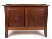 An Australian Arts & Crafts lift-top trunk, solid blackwood construction with carved floral panels, circa 1900, 79cm high, 104cm wide, 56cm deep