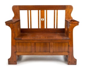 An Australian Arts & Crafts blackwood hallseat with lift-top storage base, Melbourne origin, early 20th century, with Myer Emporium label affixed, 97cm high, 114cm wide, 43cm deep