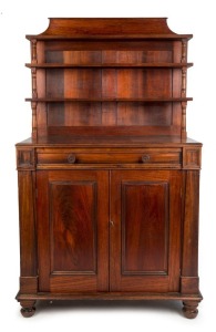 An early Colonial Australian cedar chiffonier with three cascading shelves supported on finely turned columns above a single dummy drawer and two panelled doors, Tasmanian origin, circa 1840, 178cm high, 103cm wide, 51cm deep