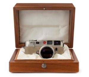 LEITZ: Leica M6 Limited Edition [#1757922], platinum and reptile skin, 1989, with engraved top plate commemorating the 150th anniversary of photography and the 75th anniversary of Leica, A122 of 1250. Fitted with Summilux-M f4 50mm lens [#3482400] and in 