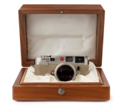 LEITZ: Leica M6 Limited Edition [#1757922], platinum and reptile skin, 1989, with engraved top plate commemorating the 150th anniversary of photography and the 75th anniversary of Leica, A122 of 1250. Fitted with Summilux-M f4 50mm lens [#3482400] and in