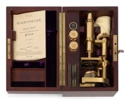 MICROSCOPE: Leitz Wetzlar replica of the first (March, 1899) microscope; 26.5cm high. Limited edition 39/100, circa 1978, with original timber case and accessories - 2