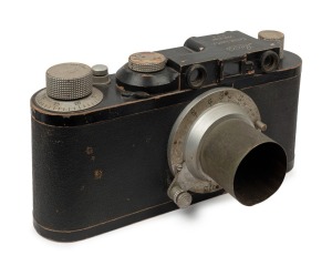 A vintage Leica point of sale advertising model, possibly in the form of a Leica II, timber and zinc, circa 1930s; 26 x 53cm.