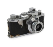 CANON NS rangefinder camera [#10880], 1941-42, with Nikkor 50mm f3.5 lens [#501380] in shutter #1917; pop up rangefinder; Canon Seiki-Kogaku&nbsp;engraved on top plate. With Canon ERC with straps. [NB: While the vulcanite body covering has deteriorated [see pi
