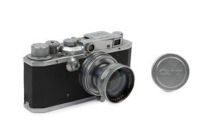 Canon 'Canon Camera Company Ltd' S-II rangefinder camera [#18712], 1947-48, with Serenar 50mm f2 lens [#20382] with metal cap; the bottom plate engraved "Made in Occupied Japan".