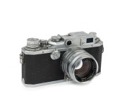 Canon rangefinder camera Model IID2, 1956 [#220586] with Canon f1.8 50mm lens [163102] and Lyon flash attachment.