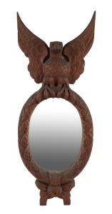 An Australian cedar mirror with carved eagle crest, late 19th century, 102 x 40cm