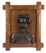 ROBERT PRENZEL pair of carved portrait panels of an Aboriginal man and woman in a headscarf, superbly carved and mounted in Prenzel's signature carved timber frames, signed "Prenzel, 1919" and "Prenzel, 1920", the larger 75 x 65cm overall - 2