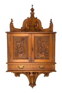 ROBERT PRENZEL (TREEDE & PRENZEL) fine Australian blackwood wall mounted corner cabinet with beautifully carved panel doors and unusual pivot hinge drawer, early 20th century, stamped "Treede & Prenzel, Sturt Street, South Melbourne", 140cm high, 84cm wide, 40cm deep