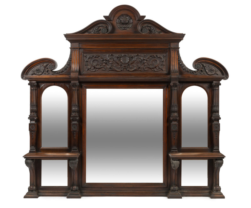 An impressive Australian mirrored overmantel with finely carved walnut frame, Melbourne origin, circa 1890s, possibly the work of Treed or Prenzel, ​168cm high, 182cm wide, 20cm deep