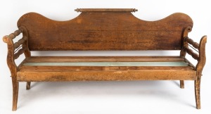 A rustic Colonial cedar miner's couch with rolling pin back, 19th century, 110cm high, 200cm wide, 61cm deep