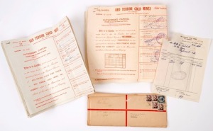 GOLD MINE SHARE CERTIFICATES: bundle of 1954 scrip for "Red Terror Gold Mines" share transfer, plus original registered envelope addressed to the transferee. The mine operated from 1947 to 1952 by the 'Red Terror Gold Mines NL' near Tennant Creek, a subs