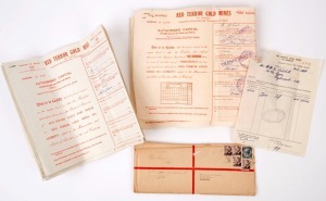 GOLD MINE SHARE CERTIFICATES: bundle of 1954 scrip for "Red Terror Gold Mines" share transfer, plus original registered envelope addressed to the transferee. The mine operated from 1947 to 1952 by the 'Red Terror Gold Mines NL' near Tennant Creek, a subsidiary company operating for entrepreneur R.M. Williams, who also operated the more lucrative Nobles Nob gold mine in the same area.