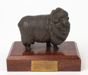 DESIGNER AWARD 1969 "Men's Knitwear, Ricardo Knitwear" cast bronze Merino sheep on timber plinth, 12cm high, 14cm wide