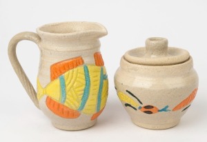 YARRABAH POTTERY lidded sugar bowl and milk jug with coloured and incised animal decoration, incised and signed "Yarrabah Pottery", the jug 13cm high