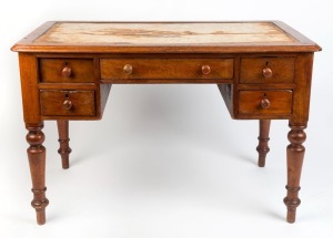 A Colonial Australian cedar five drawer desk with turned legs, circa 1860, leather insert top removed, ​​​​​​​76cm high, 116cm wide, 67cm deep