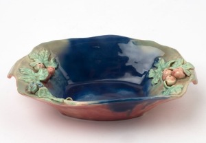 CASTLE HARRIS pottery fruit bowl with applied fruit decoration with blue glazed interior and pink exterior, incised "Castle Harris", 26.5cm wide