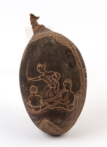 A carved boab nut with Aboriginal scene, 20th century, 17.5cm high overall