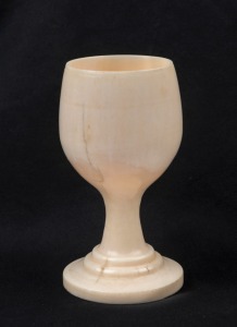 An antique eggcup made from turned whale's tooth, 19th century, 8.5cm high