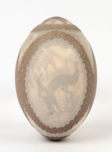 An antique carved emu egg with three vignettes titled "Australian Favourites", "While The Billy Boils" and "An Artseian Spray", 19th century