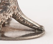 A pair of miniature silver kangaroo ornaments, 20th century, ​​​​​​​2.75cm high - 2