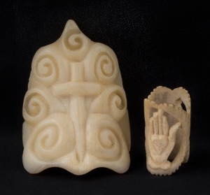 An antique carved whalebone charm, together with a carved toggle, 19th century, (2 items), 5cm and 2.5cm high