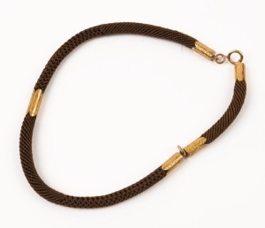 A fine antique mourning fob chain, woven hair with engraved 15ct gold mounts 19th century, 32cm long