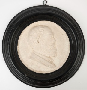 An antique Australian circular plaque with profile portrait, cast and painted plaster, 19th century, ​​​​​​​35cm diameter overall