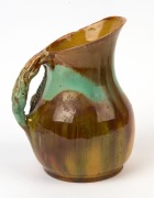 UNA DEERBON green and brown glazed pottery jug with applied branch handle, leaves and fruit, incised "Una Deerbon", 19cm high - 2