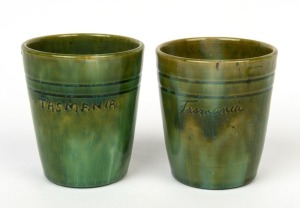 JOHN CAMPBELL pair of green glazed "TASMANIA" pottery beakers, incised "John Campbell", 9.5cm high