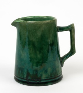 McHUGH green glazed pottery cream jug, incised "McHugh, Tasmania, ½ PT", 10cm high
