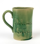 REMUED "Batman, Melbourne Centenary" green glazed pottery jug with profile portrait, incised "Remued", 12.5cm high - 2