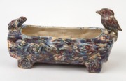 McHUGH POTTERY log flower trough with kookaburra and frog decoration, unusual mottled glazed, rare. Later branding added to base&nbsp;"H. McHugh, Tasmania", 15cm high, 30cm wide. Note: Illustrated in "McHUGH BROS. POTTERY, LAUNCESTON", by Robert Florey [Tasman - 2