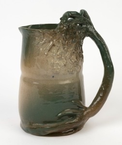 R. TAYLOR green glazed pottery jug with windswept tree and branch handle. incised "R. Taylor", 20.5cm high