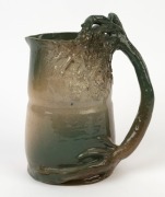 R. TAYLOR green glazed pottery jug with windswept tree and branch handle. incised "R. Taylor", ​​​​​​​20.5cm high