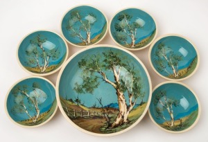 JOHN WILLIAMS seven piece pottery dessert service with hand-painted Australian landscape scenes, incised "John Williams", the largest 22cm diameter