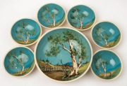 JOHN WILLIAMS seven piece pottery dessert service with hand-painted Australian landscape scenes, incised "John Williams", the largest 22cm diameter