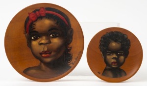 Two hand-painted wooden plaques with Aboriginal portraits, mid 20th century, 14cm and 10cm diameter